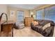 Comfortable bedroom featuring natural light, neutral colors, and cozy furniture at 23372 E Chenango Pl, Aurora, CO 80016