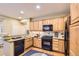 Well-equipped kitchen featuring stainless steel appliances, granite countertops, and ample cabinet space at 23372 E Chenango Pl, Aurora, CO 80016