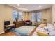 Inviting living room featuring hardwood floors, large windows, and stylish furnishings at 23372 E Chenango Pl, Aurora, CO 80016