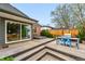 Charming backyard with a spacious wooden deck, perfect for outdoor entertaining and relaxation at 2626 Tennyson St, Denver, CO 80212
