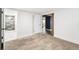 Basement bedroom leads to en suite bathroom and bonus space at 2626 Tennyson St, Denver, CO 80212