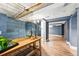 Basement bar area leads to bonus space featuring luxury vinyl plank flooring at 2626 Tennyson St, Denver, CO 80212