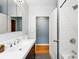 Modern bathroom featuring tile flooring, a shower/tub combo, and modern fixtures at 2626 Tennyson St, Denver, CO 80212
