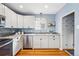 Modern kitchen with stainless steel appliances, granite countertops, and white cabinetry at 2626 Tennyson St, Denver, CO 80212