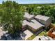 Traditional two-story home featuring a two-car garage and mature trees in a serene residential neighborhood at 12565 Eudora St, Thornton, CO 80241