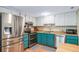 Well-lit kitchen with stainless steel appliances and a eat-in breakfast area at 12565 Eudora St, Thornton, CO 80241