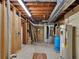 Exposed basement showing water heater, ceiling, and duct work at 40154 E Colorado Ave, Bennett, CO 80102