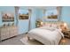 Charming bedroom with blue walls, soft lighting, and elegant decor at 40154 E Colorado Ave, Bennett, CO 80102