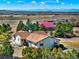 An aerial view of the home and its surroundings, showcasing the home's rural setting at 40154 E Colorado Ave, Bennett, CO 80102