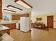 Spacious eat-in kitchen leading to the dining room with plenty of natural light at 40154 E Colorado Ave, Bennett, CO 80102