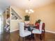 Well-lit dining area with hardwood floors and a chandelier, perfect for gatherings at 1050 S Monaco Pkwy # 126, Denver, CO 80224