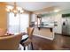 Inviting dining area open to kitchen featuring ample counter space, stainless appliances at 1050 S Monaco Pkwy # 126, Denver, CO 80224