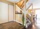 Bright entryway featuring tile floors, staircase, and closet, offering a welcoming entrance at 1050 S Monaco Pkwy # 126, Denver, CO 80224