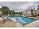 Community pool surrounded by lounge chairs, perfect for relaxation and recreation at 1050 S Monaco Pkwy # 126, Denver, CO 80224