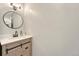 Modern bathroom with decorative vanity, a round mirror and sleek fixtures at 750 Tabor St # 46, Lakewood, CO 80401