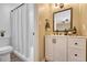 Bathroom with white vanity, sleek black faucet, and a well-lit mirror at 750 Tabor St # 46, Lakewood, CO 80401