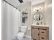 Modern bathroom with a shower, vanity, stylish lighting, and decorative floating shelves at 750 Tabor St # 46, Lakewood, CO 80401