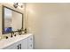 Bright bathroom with a modern white vanity, ample counter space, and stylish black hardware at 750 Tabor St # 46, Lakewood, CO 80401