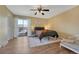 Bright bedroom with wood floors, balcony access, and a serene ambiance with modern decor at 750 Tabor St # 46, Lakewood, CO 80401