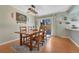Comfortable dining area with rustic wood table, stylish lighting, and a sliding glass door at 750 Tabor St # 46, Lakewood, CO 80401