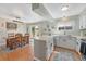 Bright kitchen featuring white cabinets, modern appliances, and an adjacent dining area at 750 Tabor St # 46, Lakewood, CO 80401
