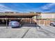 Covered parking featuring assigned parking spot and view of fenced backyard at 750 Tabor St # 46, Lakewood, CO 80401