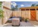 Cozy fenced patio with outdoor seating, plants, and a modern patio rug for relaxing at 750 Tabor St # 46, Lakewood, CO 80401