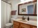 Bathroom featuring a vanity with marble countertops, shower with curtain, and light gray walls at 508 Viola St, Palmer Lake, CO 80133