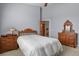 Bedroom featuring carpeted floors, light gray walls and wood furniture at 508 Viola St, Palmer Lake, CO 80133