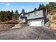 Stunning gray two-story home boasts a two-car garage and tasteful landscaping at 508 Viola St, Palmer Lake, CO 80133