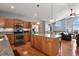 Modern kitchen featuring stainless steel appliances, granite countertops, and a large island at 508 Viola St, Palmer Lake, CO 80133