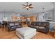 Open-concept living area flows into kitchen, featuring hardwood floors and lots of light at 508 Viola St, Palmer Lake, CO 80133