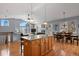 Open-concept kitchen flows into living room, featuring a fireplace and nice windows at 508 Viola St, Palmer Lake, CO 80133