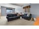 Inviting living room with a comfortable sofa, chair, and ample natural light creating a cozy and welcoming atmosphere at 508 Viola St, Palmer Lake, CO 80133