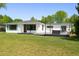 Expansive backyard with a well-maintained lawn and a large deck perfect for outdoor entertaining at 2675 S Eudora St, Denver, CO 80222
