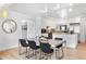 Bright open-concept kitchen with island, connected to the dining and living areas for easy entertaining at 2675 S Eudora St, Denver, CO 80222