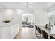 Open-concept home with a view from the dining area into the living room and beyond at 2675 S Eudora St, Denver, CO 80222