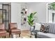 Living room with a built-in bookcase, hardwood floors, plenty of natural light, and comfortable seating at 2675 S Eudora St, Denver, CO 80222