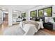 Spacious main bedroom with large mirrored closet, modern lighting, and wood flooring at 2675 S Eudora St, Denver, CO 80222