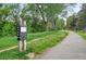 Picturesque walking path surrounded by lush greenery and mature trees for outdoor enjoyment at 2675 S Eudora St, Denver, CO 80222