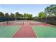Well-maintained tennis courts surrounded by lush trees for recreational play and exercise at 2675 S Eudora St, Denver, CO 80222