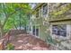 View of wooden back deck with sliding door and mature tree canopy providing shade at 3966 Bosque Ct, Boulder, CO 80301