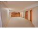 Large basement area featuring built-in shelving and ample room for customization at 3966 Bosque Ct, Boulder, CO 80301