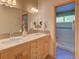 Bathroom with double sink vanity and tiled shower with glass door at 3966 Bosque Ct, Boulder, CO 80301