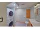 Bathroom featuring a stacked washer and dryer, walk-in shower, and single vanity at 3966 Bosque Ct, Boulder, CO 80301