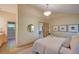 Comfortable bedroom featuring neutral tones, carpet and ensuite bathroom at 3966 Bosque Ct, Boulder, CO 80301