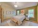 Comfortable bedroom with ample natural light, a neutral color scheme, and wood accents at 3966 Bosque Ct, Boulder, CO 80301