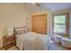 Cozy bedroom featuring a comfortable bed, natural light, and closet at 3966 Bosque Ct, Boulder, CO 80301