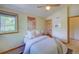 Comfortable bedroom with a cozy bed, window, and warm, inviting decor at 3966 Bosque Ct, Boulder, CO 80301