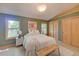 Comfortable bedroom with ample natural light, a neutral color scheme, and wood accents at 3966 Bosque Ct, Boulder, CO 80301